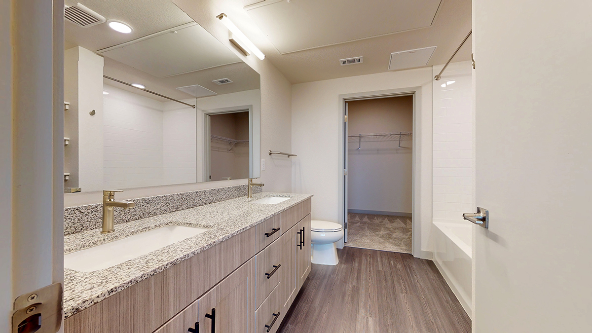 Bathroom with double vanity and oversized mirror
