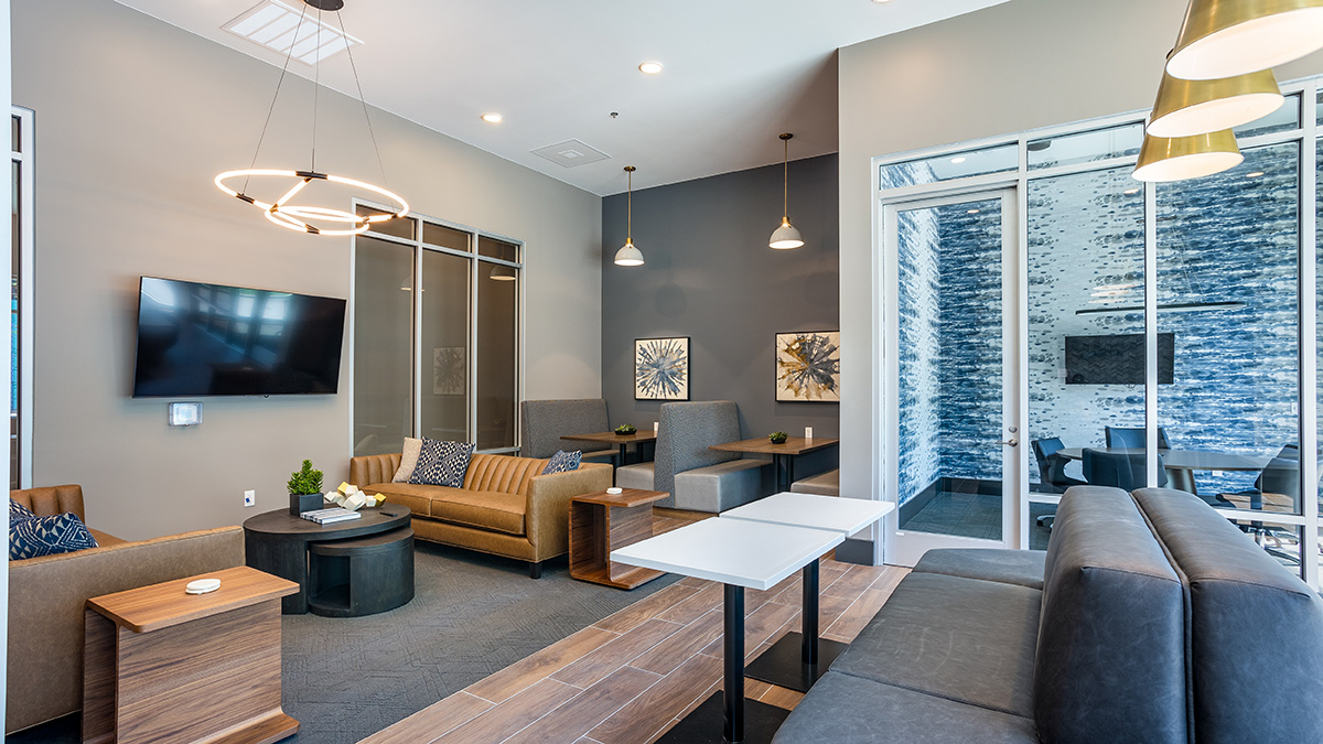 Coworking lounge with private meeting room at Railside at Wadsworth Station