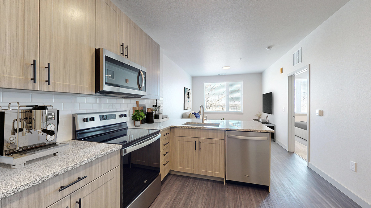 Kitchen with pro grade stainless steel appliances at Railside at Wadsworth