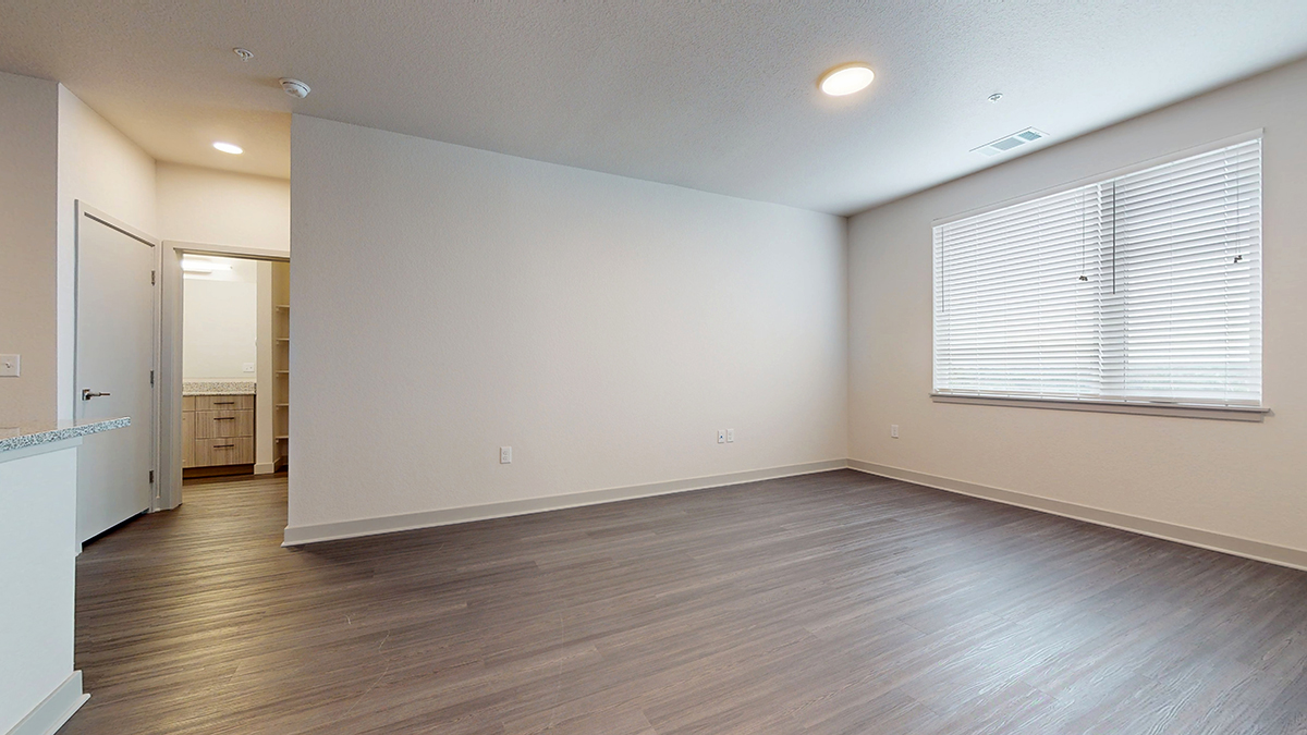 Living room with vinyl plank flooring at Railside at Wadsworth Station